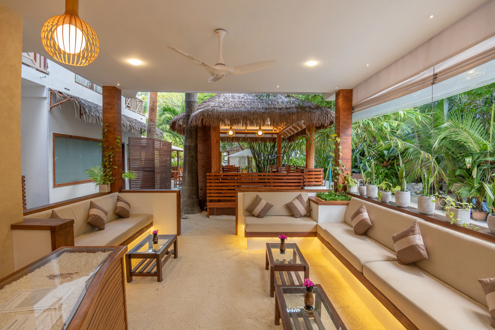 The open-air lobby lounge and reception at Ostrov Beach on Ukulhas