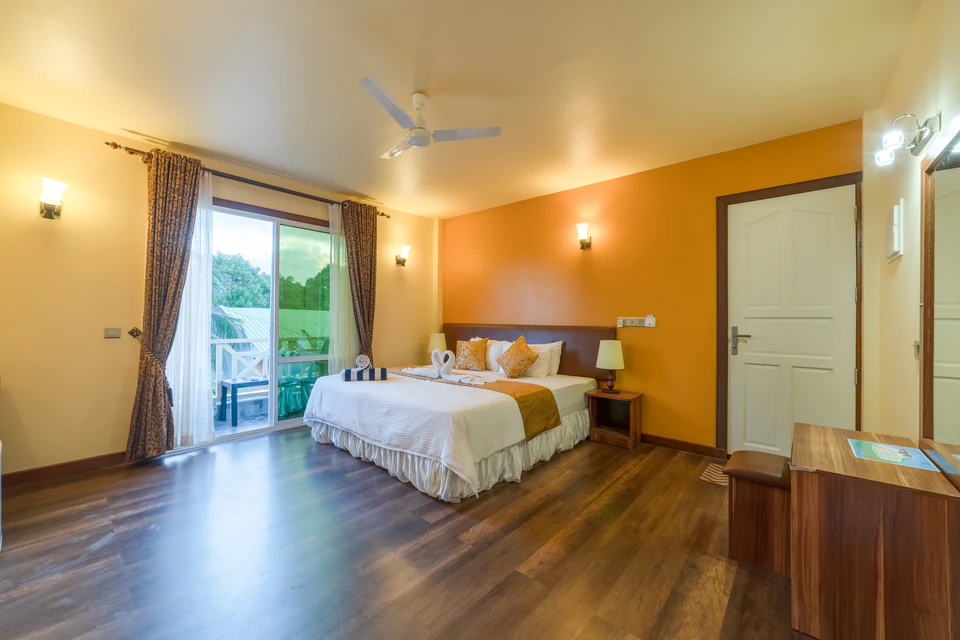 Wide double-bed room view facing the private balcony