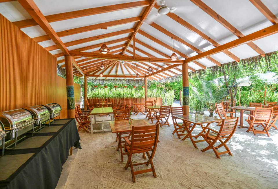 Wide view of the covered restaurant seating and buffet line