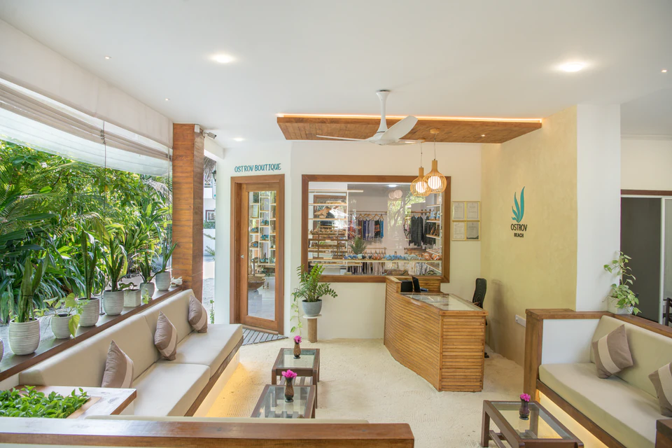 Wide view of the reception lounge and adjacent boutique entrance