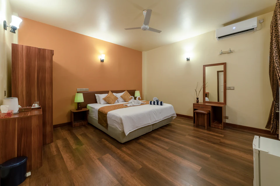Alternate double-bed room overview from beside the window