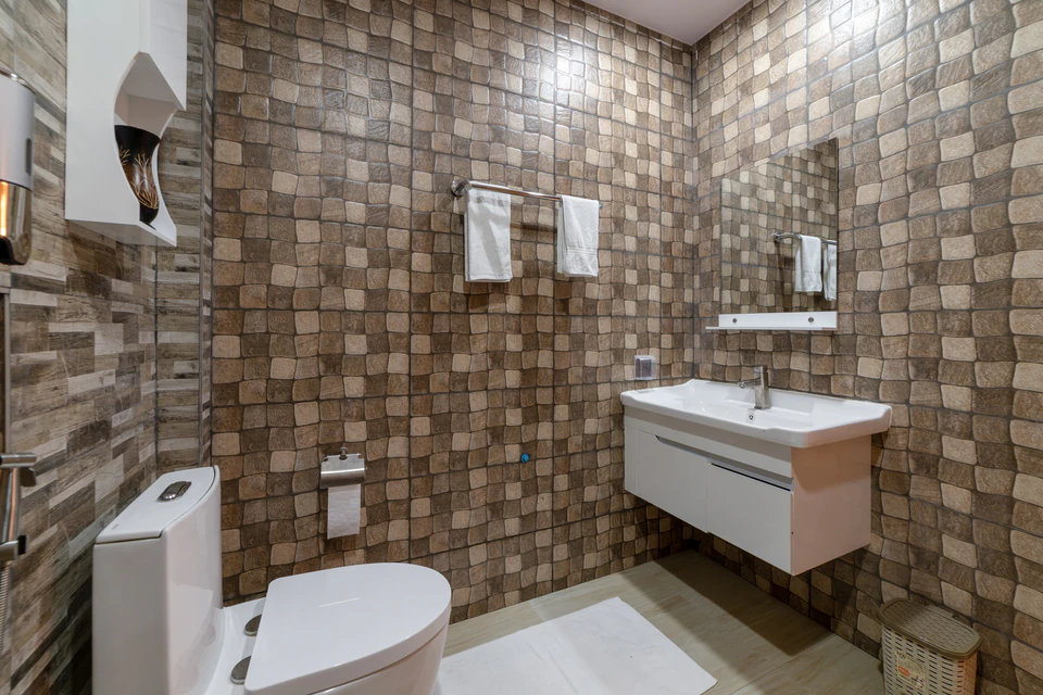 Alternate bathroom angle showing the toilet and vanity