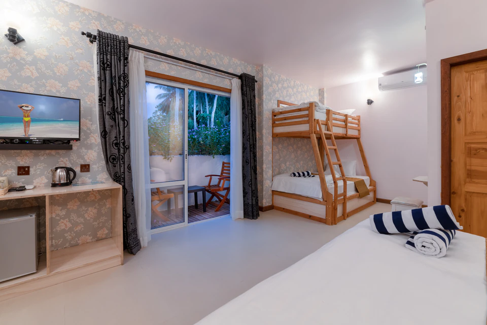 Family room view with bunk beds and balcony doors