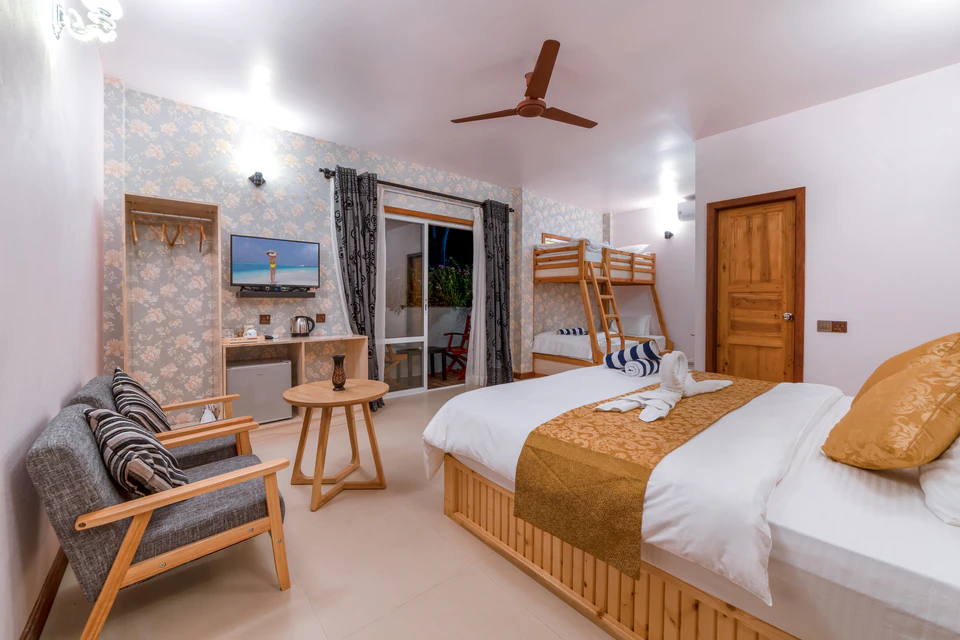 Double bed, bunk beds, and indoor seating in the family room