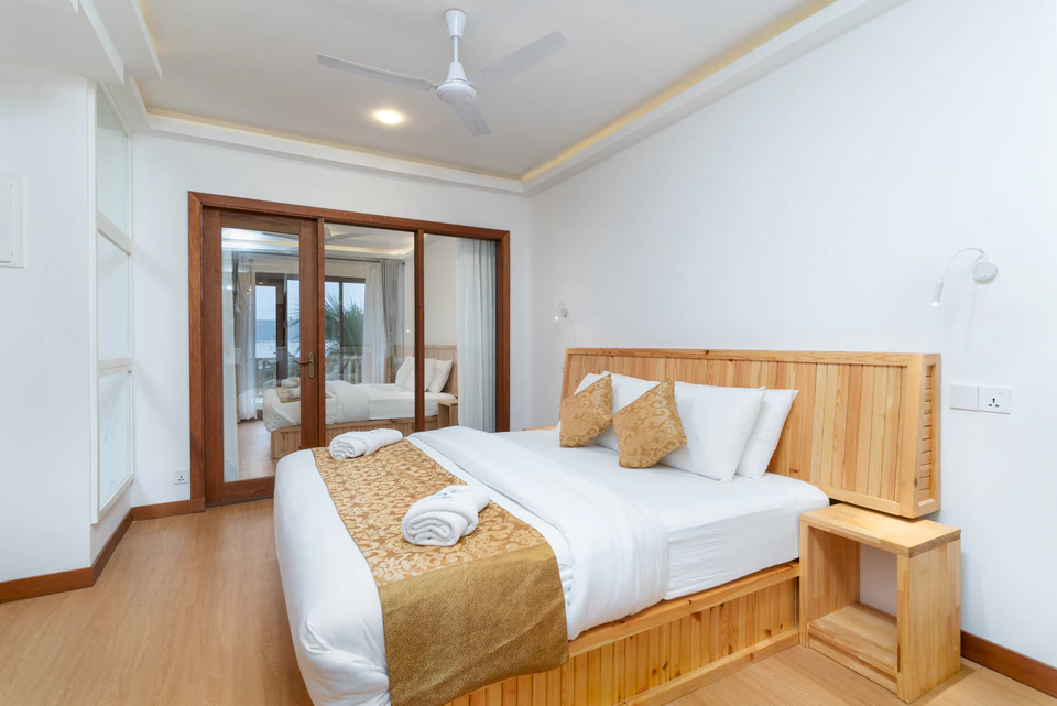 Double bedroom facing the glass balcony doors