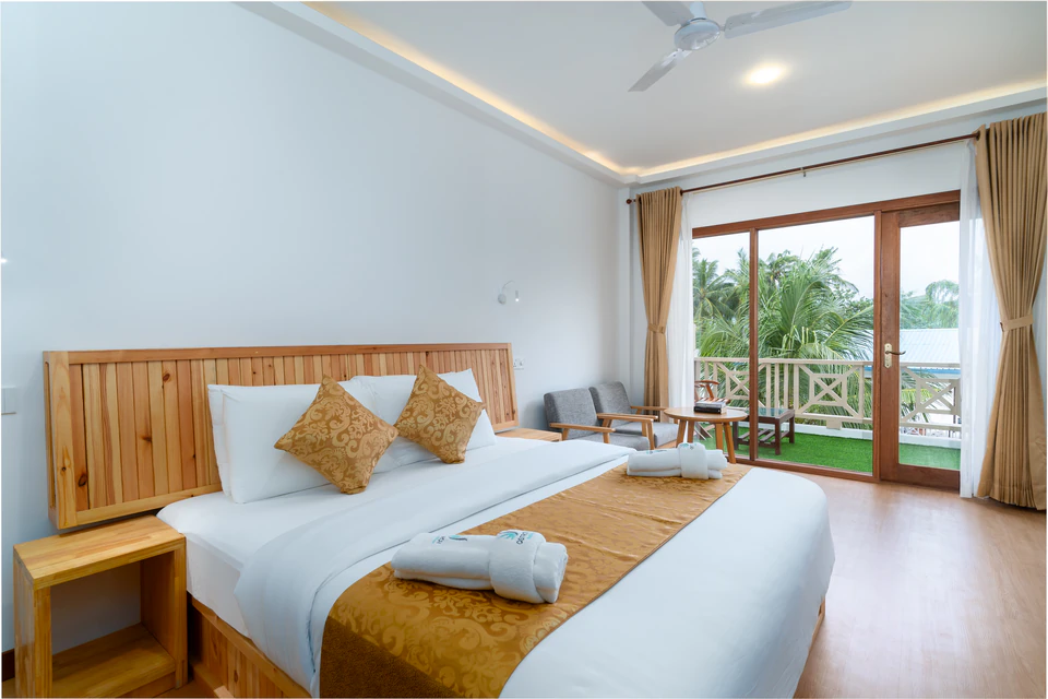 Front view of the double bed and balcony doors