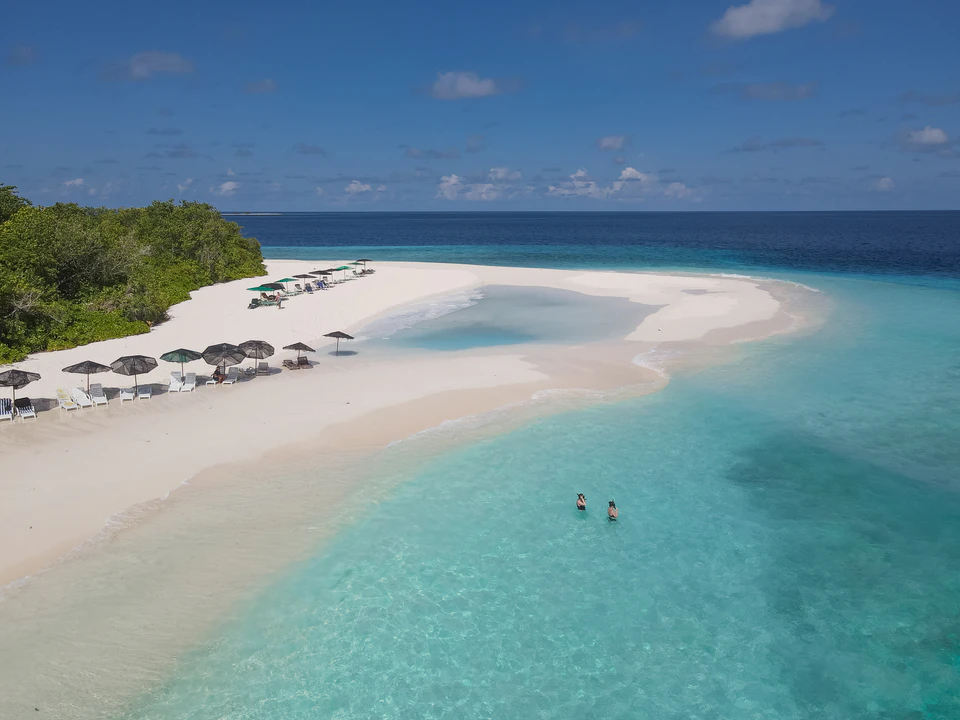 Alternate aerial wide view of a white sandbank and turquoise lagoon
